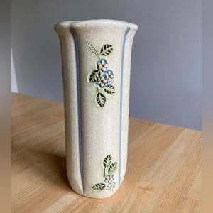 Hand made pottery vase with blue flowers
